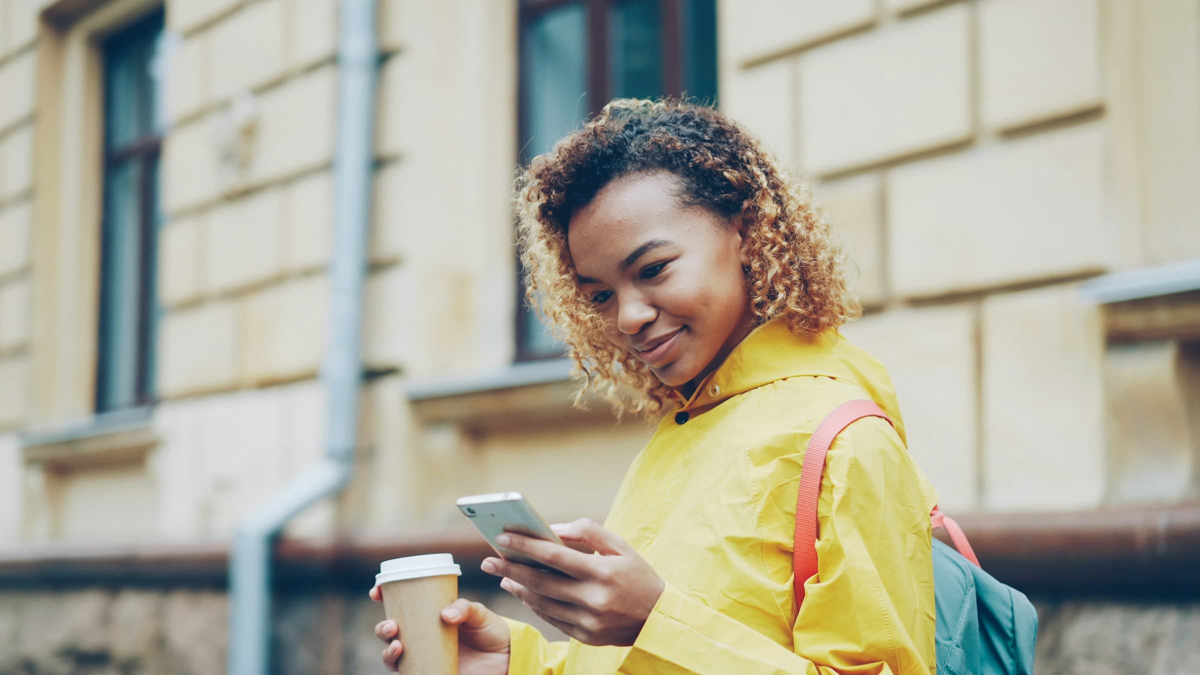 A customer using mobile money on her phone